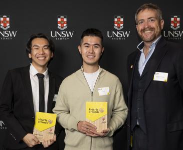 Three people, award winners William Nguyen (left) and Zili Chen (centre), with Vice-Chancellor and President Professor Attila Brungs