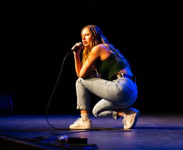 Anastasia Shavrova crouching on stage