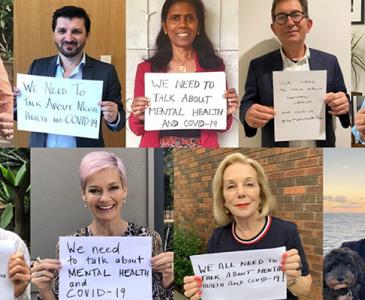 UNSW leaders holding mental health signs