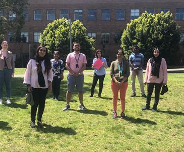 students coming together for breast cancer awareness day