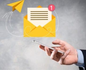 A hand reaching out to an email icon