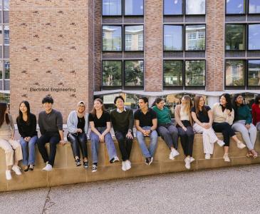 Co-op students sitting outside electrical engineering