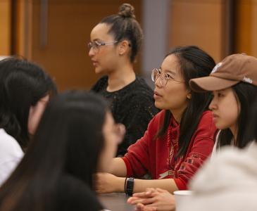 A group of people at tables