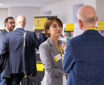 Two people talking at an event