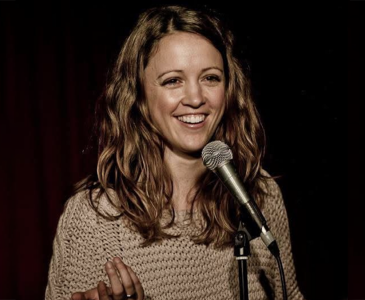 Justine Rogers at a microphone
