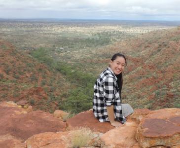Naomi Huynh sitting on a ledge at King's Canyon
