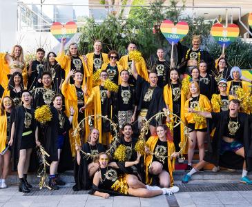 A group of people in costume posed on the Basser Steps