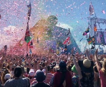 People enjoying a performance at a music festival 