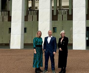 Members of the OCD BOUNCE team standing outside Parliament House in Canberra