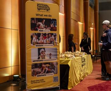 A banner for OzHarvest in Leighton Hall