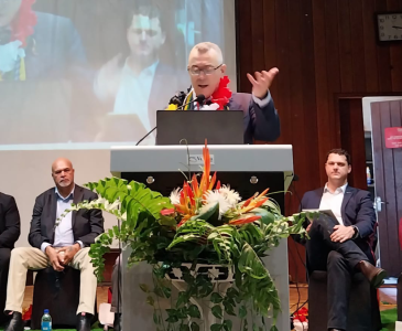 A person speaking at a podium