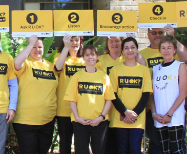 UNSW staff in yellow R U OK Day t-shirts outside the Chancellery