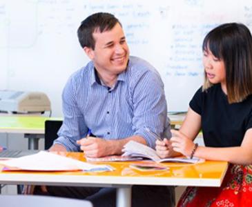 Students sitting together at a table talking