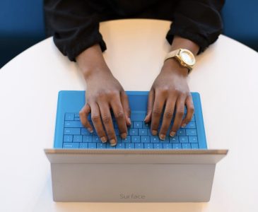 Hands on a laptop computer