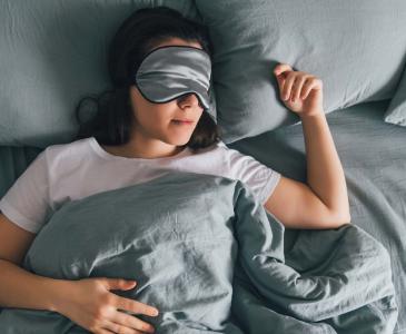 Sleeping lady with facemask on