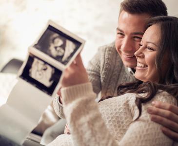 Couple looking at photo