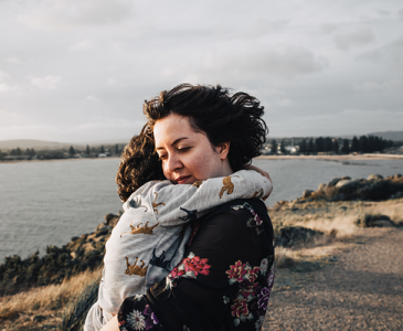 Mother hugging child