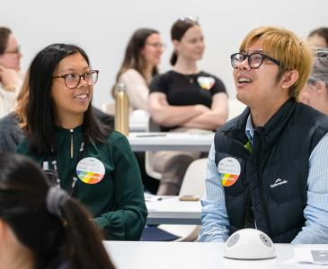 Two people smiling during ally@UNSW training