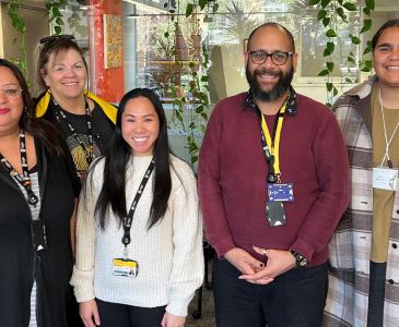 Photograph at Nura Gili, with staff Tanya Griffiths, Lizzy Mayers, Kyla Sumaylo, Quinton Vea Vea and current student, Rosina Baumann