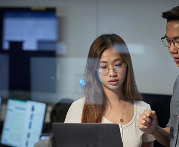 Woman and man with a laptop