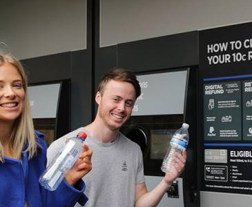 Students using the Return and Earn reverse vending machine