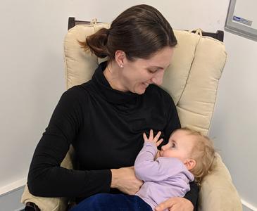 Suzanne Austin feeding her daughter