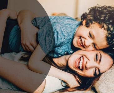 Mother and child hugging with text "Managing Mental Wellbeing for You and Your Family"