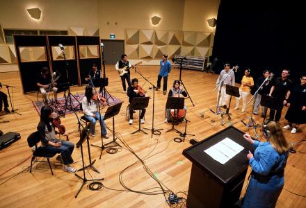 A music ensemble in a large recording space