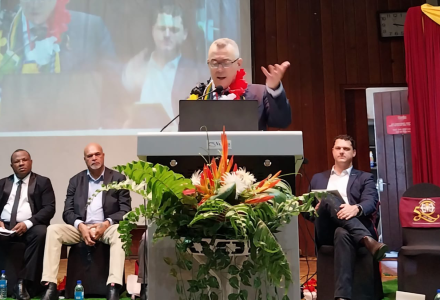 A person speaking at a podium