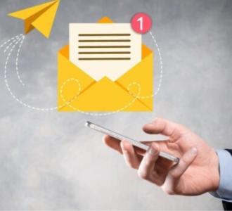 A hand reaching out to an email icon