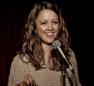 Justine Rogers at a microphone