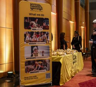 A banner for OzHarvest in Leighton Hall