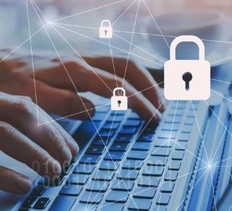 Close up of hands on a laptop overlaid with lock image