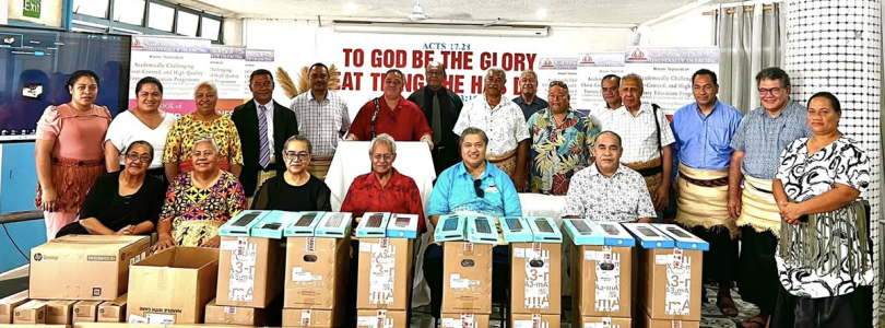 Christ’s University in Pacific staff in Tonga with computer equipment donated by UNSW