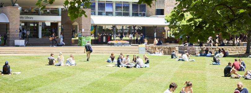 People sitting on Library Lawn at UNSW's Kensington campus