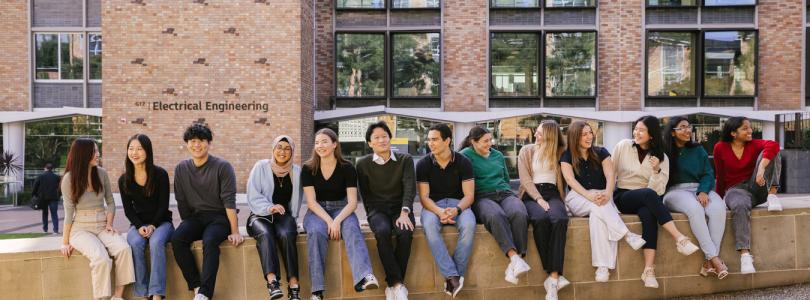 Co-op students sitting outside electrical engineering