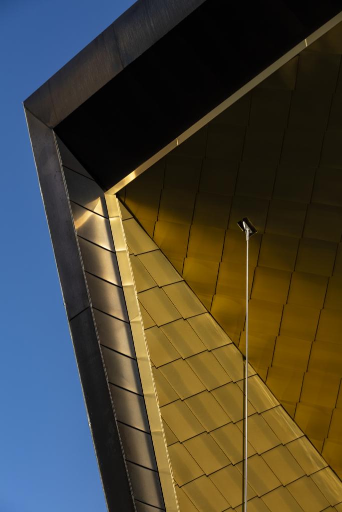 Clancy Auditorium golden shingles - Photo credit: Brett Boardman/Lahz Nimmo Architects
